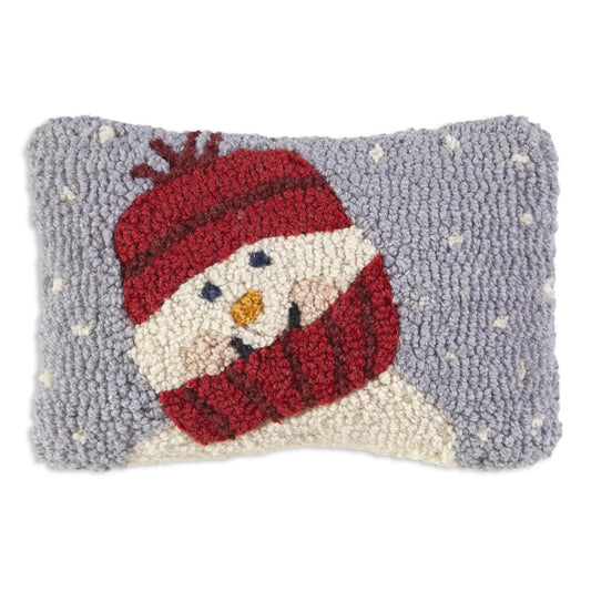 Decorative pillow with a snowman design on a gray background