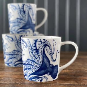 Mugs with blue octopus design on white porcelain