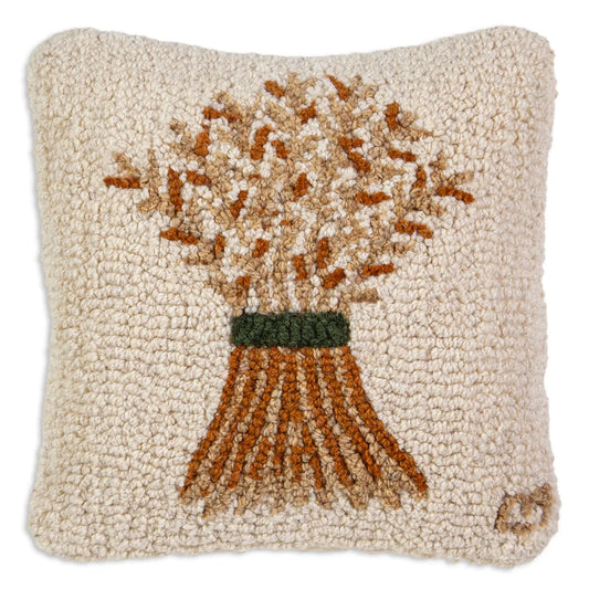Decorative pillow with a design of a bundle of wheat on a beige background