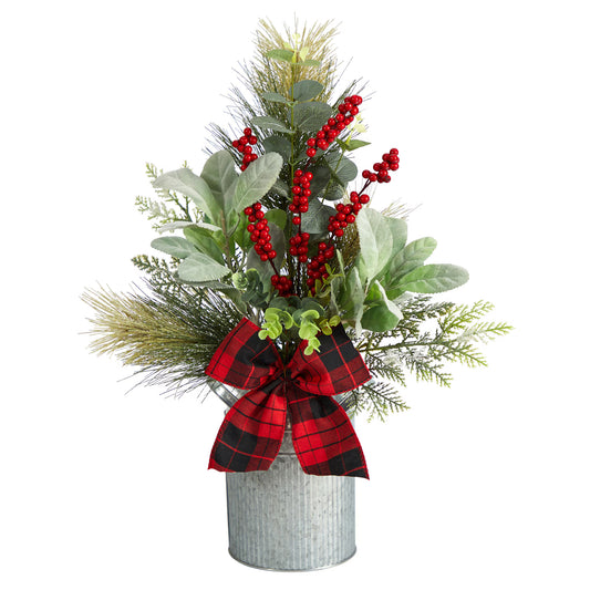 Decorative arrangement with greenery, red berries, and a plaid bow in a metal container 